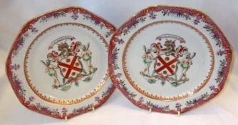 A pair of Armorial Plates, the borders decorated in the Oriental manner with a puce scale rim, and