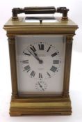 A late 19th Century French lacquered Brass Carriage Clock with repeating and striking Alarm