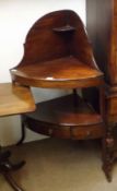 An early 19th Century Mahogany Corner Wash Stand of typical form with galleried back, two shelves,