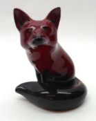 A Royal Doulton Flambé Model of a seated fox, 4 ½” high
