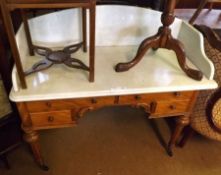 A Victorian Wash Stand, the cream marble galleried top to a satinwood base, fitted with two long and