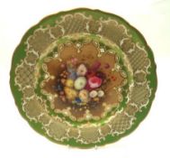 A Coalport Cabinet Plate, decorated with a floral centre and geometric gilt and green border,