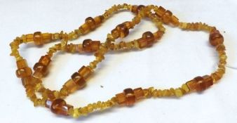 An Amber Bead Necklace with regular and irregular shaped beads, approximately 76mm long and weighing