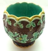 A late 19th Century Jardinière, decorated with sprays of oak leaves and acorns on a brown