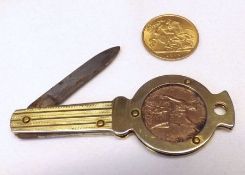 A George V Gold Half-Sovereign, 1913; together with a Gold Plated Cased Penknife with coin inset (