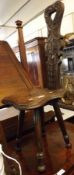 A late Victorian Carved Oak Spinners type Stool, with extensively carved back, raised on four turned