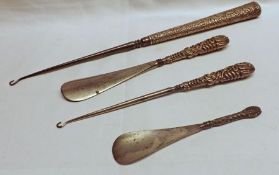A packet containing an Extra Long Steel and Silver Mounted Buttonhook, with chased decoration, 14”