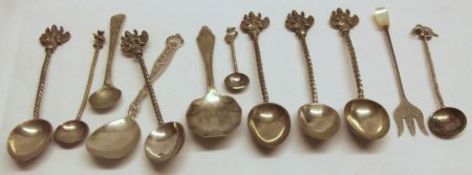 A Mixed Lot comprising: a “Sterling” Preserve Spoon; five Siamese Twist Stem and Figure Finial
