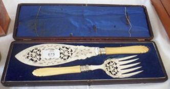 A Cased Pair of Victorian Electroplated Fish Servers with foliate engraved and pierced blades,