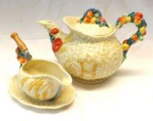 A Clarice Cliff “Celtic Harvest” small Sauceboat on Stand, with coloured relief moulded floral