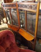 A late Victorian/early 20th Century Glazed Mahogany Screen with fretwork detail fitted with two