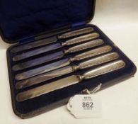 A cased set of six George V Steel Bladed Cake Knives with embossed Silver handles, Sheffield 1918