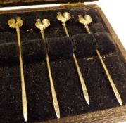 A Case containing four (of six) Cocktail Sticks with cockerel finials, 3” long, Birmingham 1923