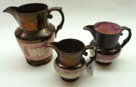 A graduated set of three 19th Century Copper and Puce Lustre Jugs, decorated with naïve scenes,