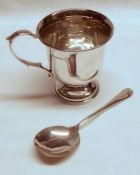An Elizabeth II Christening Mug of cup form with scrolled handle (un-inscribed), Birmingham 1953 (