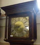 An Oak Longcase Clock with overhanging cornice, the square brass dial with circular silvered Roman