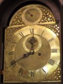 A late 18th/early 19th Century Mahogany Longcase Clock with arched brass dial, John Wood of