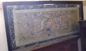 A large Framed 20th Century Oriental Silkwork Picture, with decorated border and a central panel