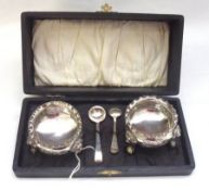 A Cased Pair of late Victorian Electroplated Circular Salts on three lion mask and paw feet, plus