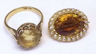 A yellow metal circular Citrine Dress Ring, claw set; together with a late 19th/early 20th Century