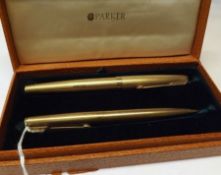 A Parker hallmarked 9ct Gold Fountain Pen and Propelling Pencil, each with engine-turned decoration,