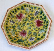 A Chinese Octagonal Plate, the centre painted in underglaze blue, famille verte and rose with