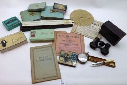 A Mixed Lot: Vintage Tins, small Binoculars, various Vintage Tobacco Packets, Slide Rule, Ready