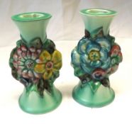 A pair of Clarice Cliff “My Garden” Candlesticks with green glaze streaked bodies and central panels