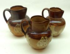 Two Royal Doulton Lambeth Stoneware Harvest Jugs and a further 1887 Jubilee Commemorative Jug (