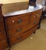 A 19th Century Bow Front Mahogany Chest of two short and two full length drawers, inlaid with