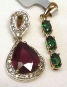 A hallmarked 9ct Gold large red stone and small Diamond surround Teardrop Design Pendant with open