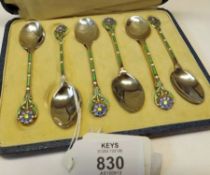 A cased set of six George V Coffee Spoons with floral enamelled finials and stems, Birmingham 1931/3
