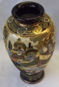 A large 20th Century Oriental Satsuma Baluster Vase, decorated with panels of immortals on a