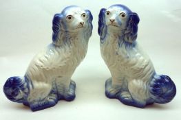 A pair of 20th Century Woods Models of Staffordshire type spaniels, in blue and white, 10” high