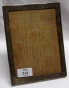 A George V Plain Rectangular Silver Mounted Photograph Frame, with wooden easel back, 7 ½” x 6”,