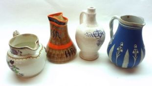 A Mixed Group of four assorted Jugs, to include Myott & Sons orange decorated example, Copeland