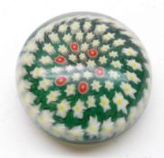 A 20th Century Paperweight with radiating foliate design on a predominantly green ground, 3 ¾”