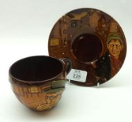 A Royal Doulton Kings Ware Cup and Saucer, decorated with a scene of Mr Pickwick on a brown