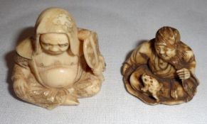 Two Oriental Ivory Carved Netsukes, in the form of hooded figure with a fan and a bearded man with a