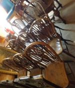 A composite set of eight late 19th Century Windsor style Stick Back Chairs, the hooped backs with
