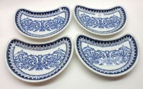 A set of four Brown Westhead & Moore blue and white kidney-shaped Dishes, 9 ½” diameter