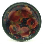 A Moorcroft Circular Shallow Bowl, decorated with a Pomegranate design on a blue/green ground,