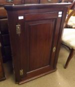 A 19th Century Mahogany Single Door Corner Cabinet, of typical form fitted with brass H hinges and