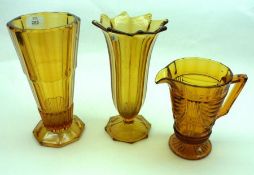 A collection of various Amber Glass Jugs and Vases