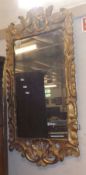 A 19th Century Giltwood Framed Rectangular Wall Mirror, the frame extensively carved with foliage
