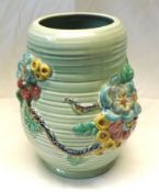 A Clarice Cliff Large Ribbed Baluster Vase, relief moulded with a coloured floral design, green