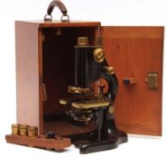 An early 20th Century black anodised and brass mounted Microscope by Chapman & Alldridge in original