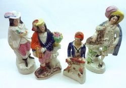 A group of four 19th Century Staffordshire Figures: Shepherd, Scotsman etc, all decorated throughout