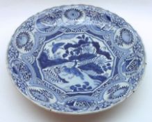 A 20th Century Delft Blue and White Charger, the centre decorated with scene of ducks and foliage,