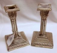 A Matched Pair of Edwardian Cluster Column Dressing Table Candlesticks, on stepped and loaded square